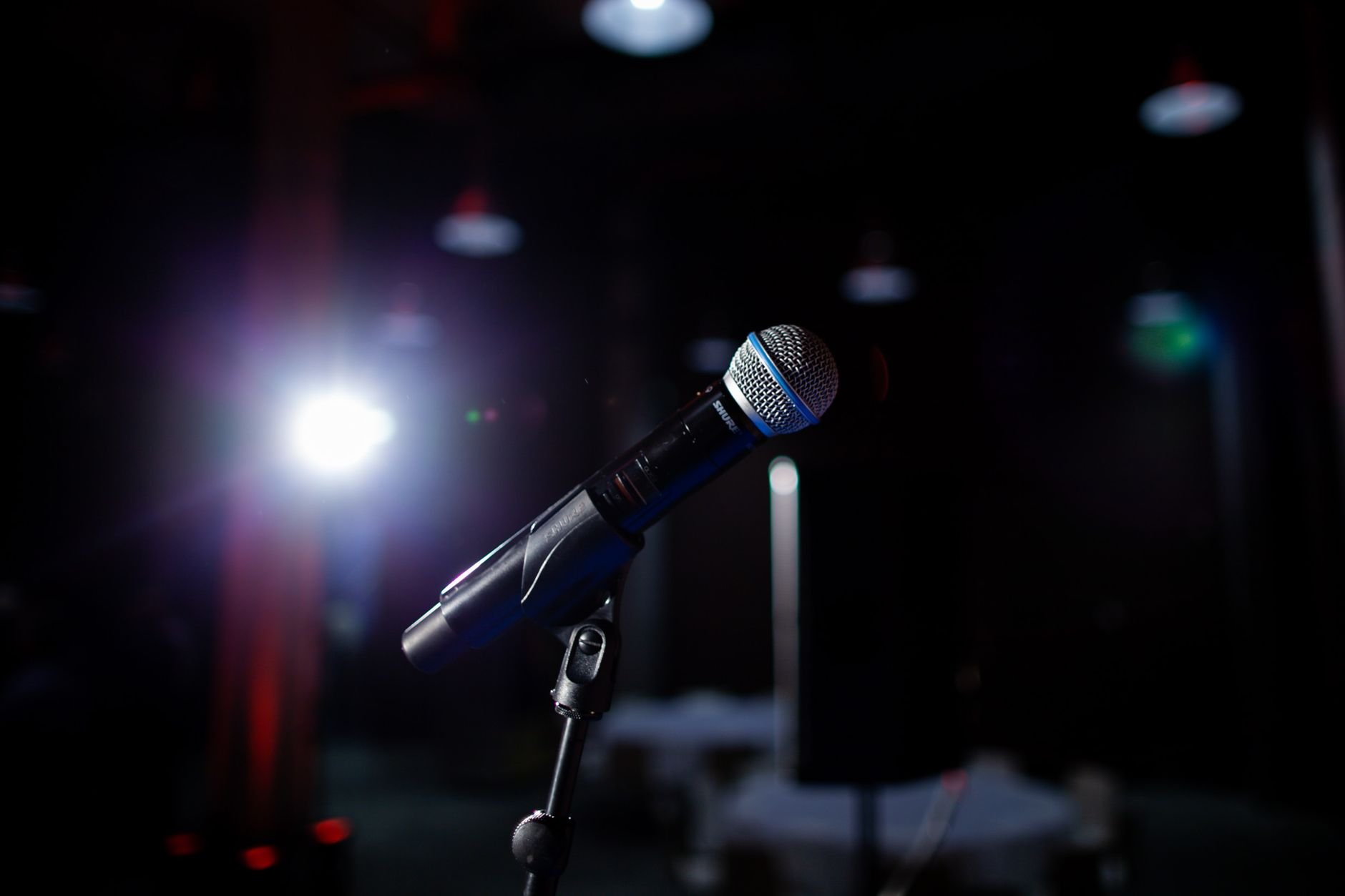 Spotlight on a microphone — the next legend drops soon
